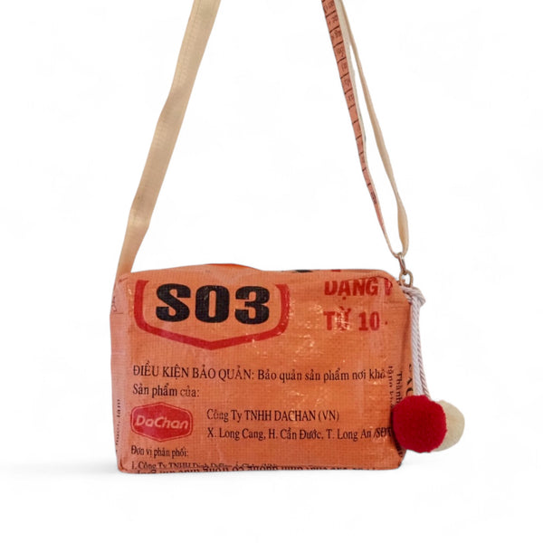 Crossbody Bag in orange-schwarz mit Bommeln