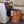Lade das Bild in den Galerie-Viewer, upcycelter, orange-schwarzer Wäschekorb - innen blau - steht neben einer Waschmaschine
