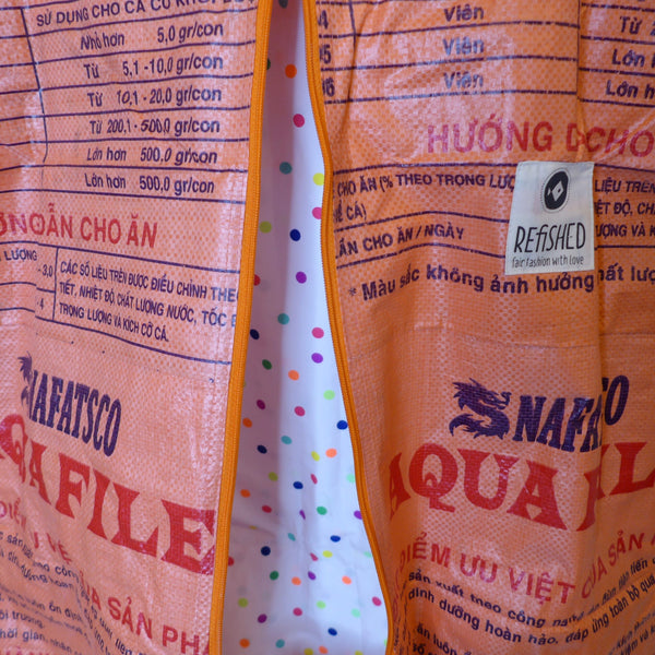 SUIT BAG | Environmentally friendly garment bag in aqua orange
